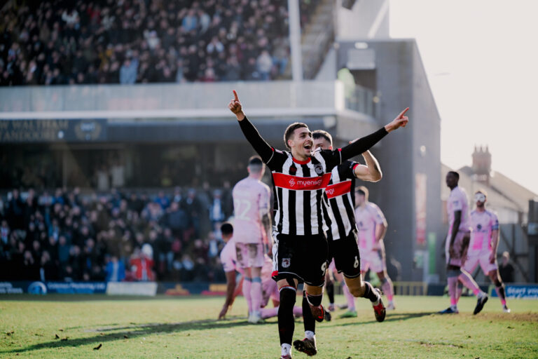 GTFC player celebrating on the pitch showing myenergi front shirt sponsor