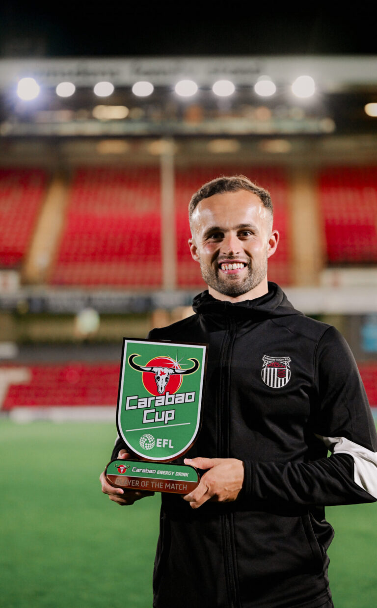 GTFC player holding the Carabao Cup trophy