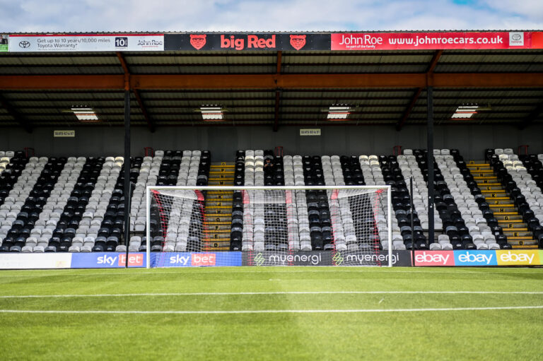 Photograph of the goal and the stands at Blundell Park