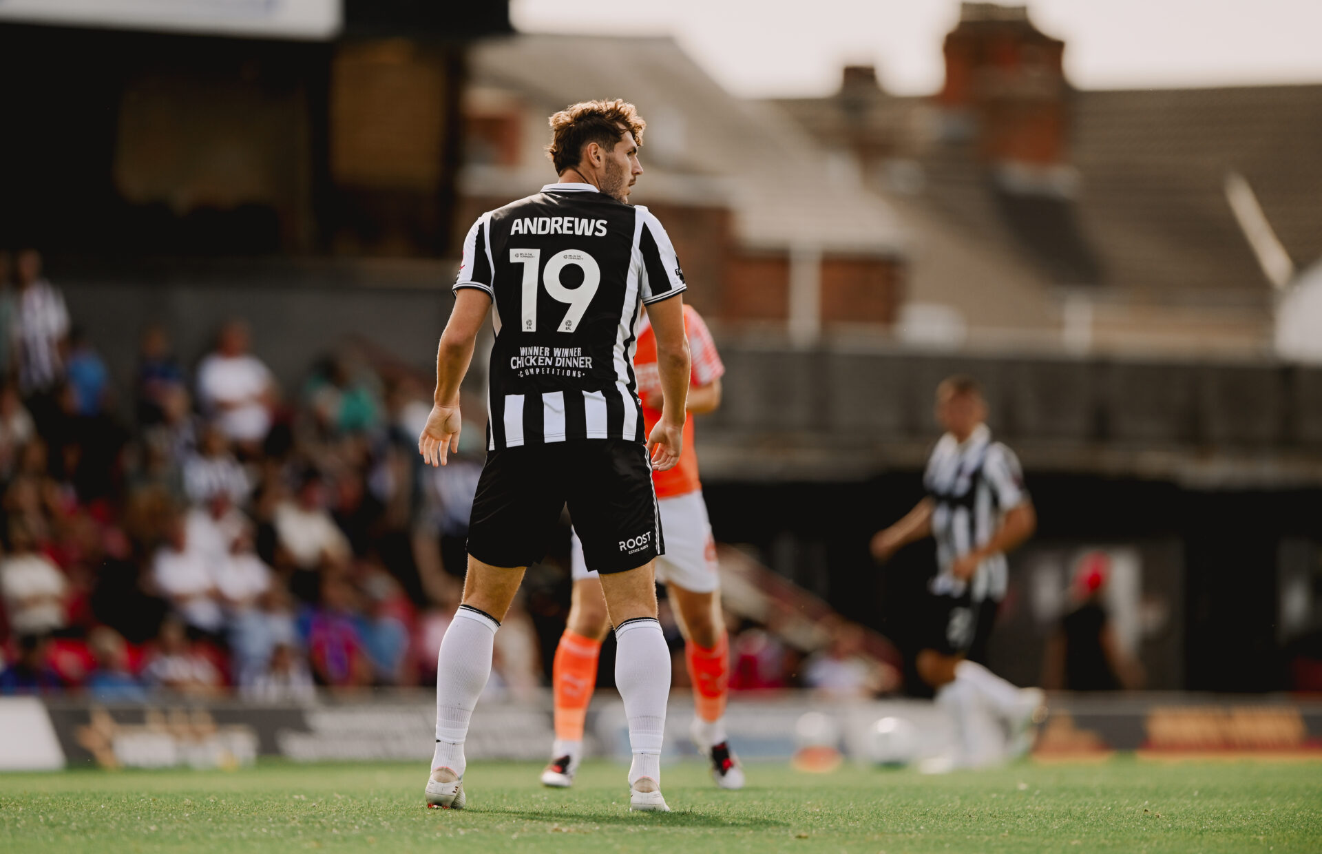 Andrews 19 shown on the pitch. Winner Winner Chicken Dinner sponsor logo shown on the back of shirt