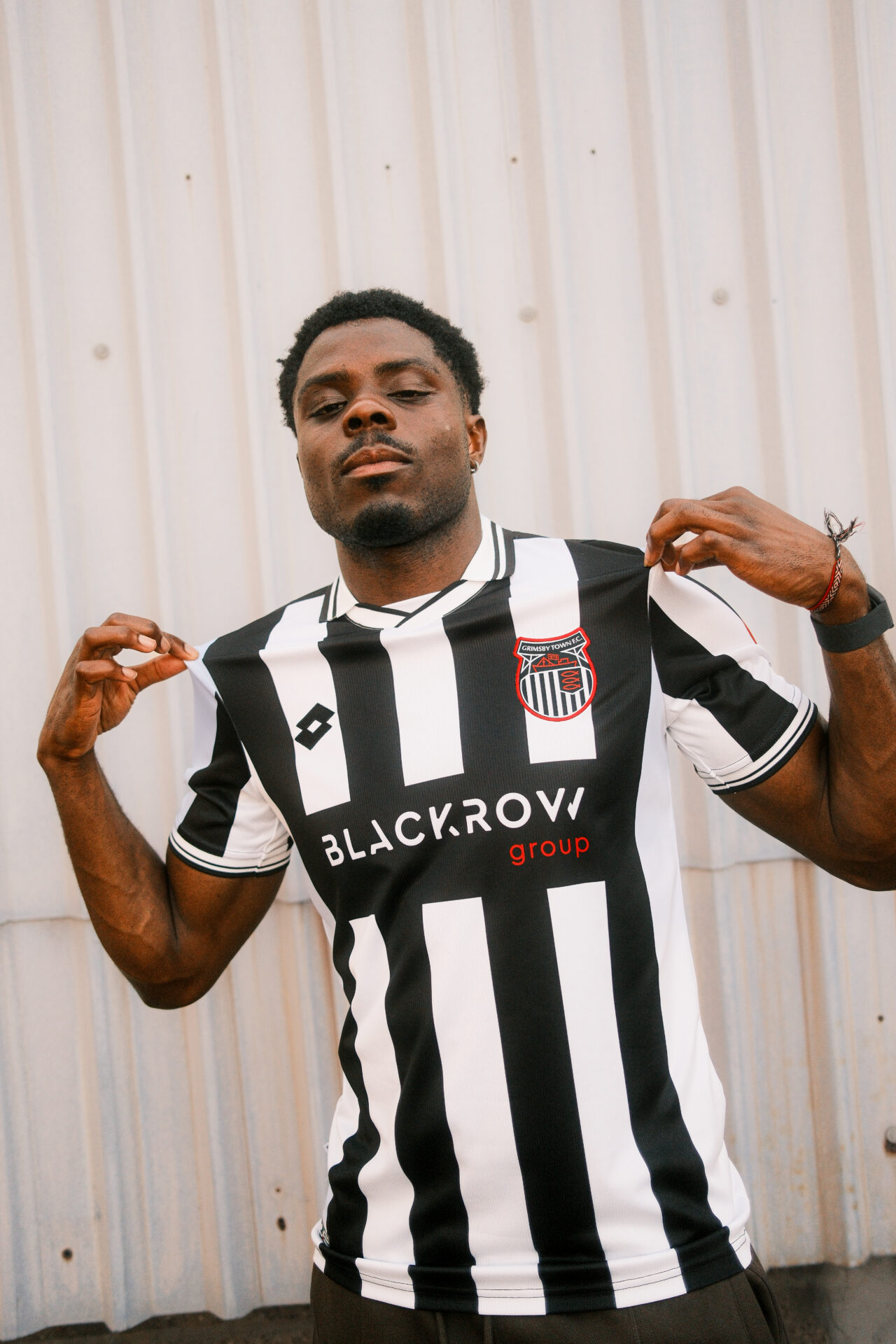 14. Justin Amaluzor shown wearing his latest GTFC shirt with the Blackrow Group front shirt sponsor